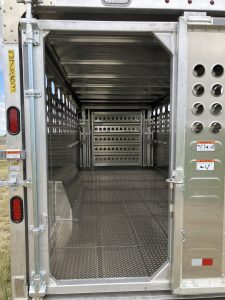 24' x 8' Stock Combo Trailer. Tandem 8,000 lbs Torsion Axles. ST215/75 R17.5(M) 16 Ply Tires on 17.5 X 6.75 Steel Rims. One Moveable Divide Gate. 36" Roadside Door.