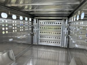 24' x 8' Stock Combo Trailer. Tandem 8,000 lbs Torsion Axles. ST215/75 R17.5(M) 16 Ply Tires on 17.5 X 6.75 Steel Rims. One Moveable Divide Gate. 36" Roadside Door.
