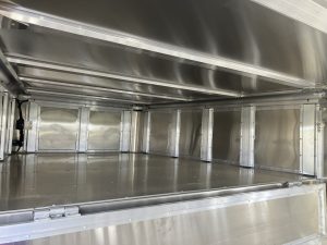 24' x 8' Stock Combo Trailer. Tandem 8,000 lbs Torsion Axles. ST215/75 R17.5(M) 16 Ply Tires on 17.5 X 6.75 Steel Rims. One Moveable Divide Gate. 36" Roadside Door.