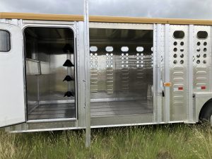 Tandem 8,000 lbs Torsion Axles ST215/75 R17.5(M) 16 Ply Tires on 17.5 X 6.75 Steel Rims. Locking Tack Room with Four Removable Saddle Racks, Bridle Hooks, and Blanket Bar. One Fixed Divide Gate. 52" Roadside Door perfect for side-loading a four wheeler. Six Inside Tie Loops. Four Outside Tie Loops Roadside.
